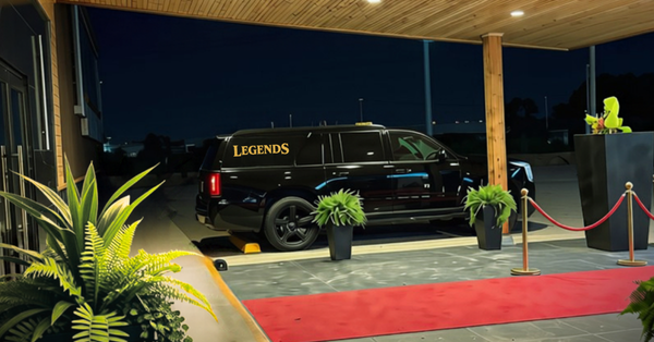 Legends shuttle outside the venue at night