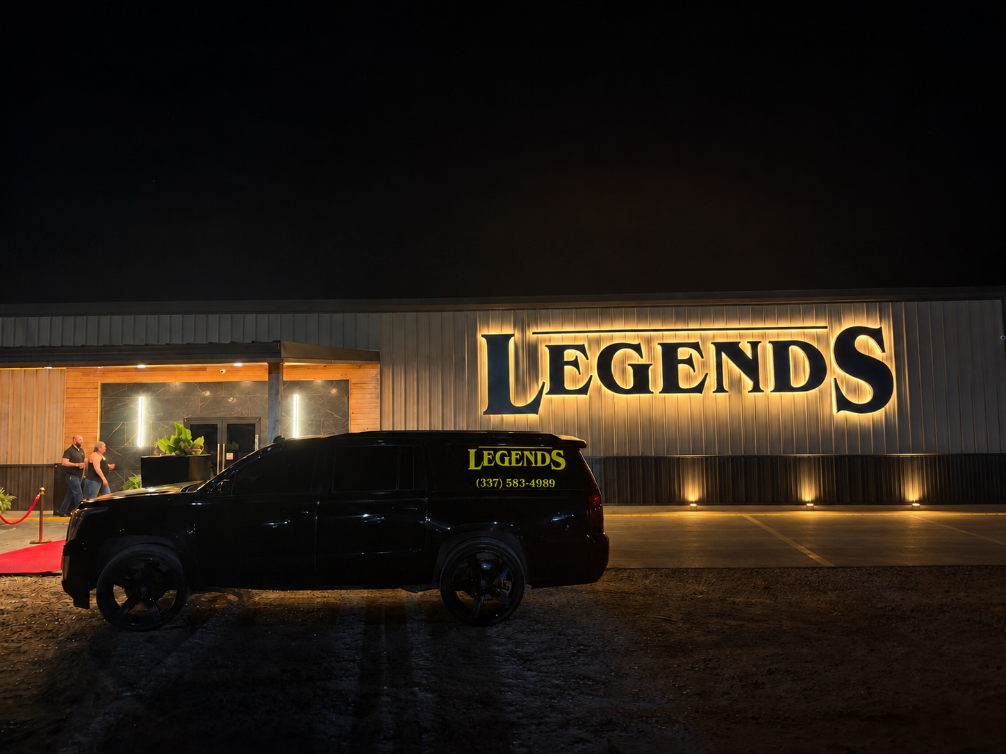 Legends venue with its illuminated sign and shuttle outside